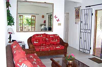 Living room out to verandah and garden.